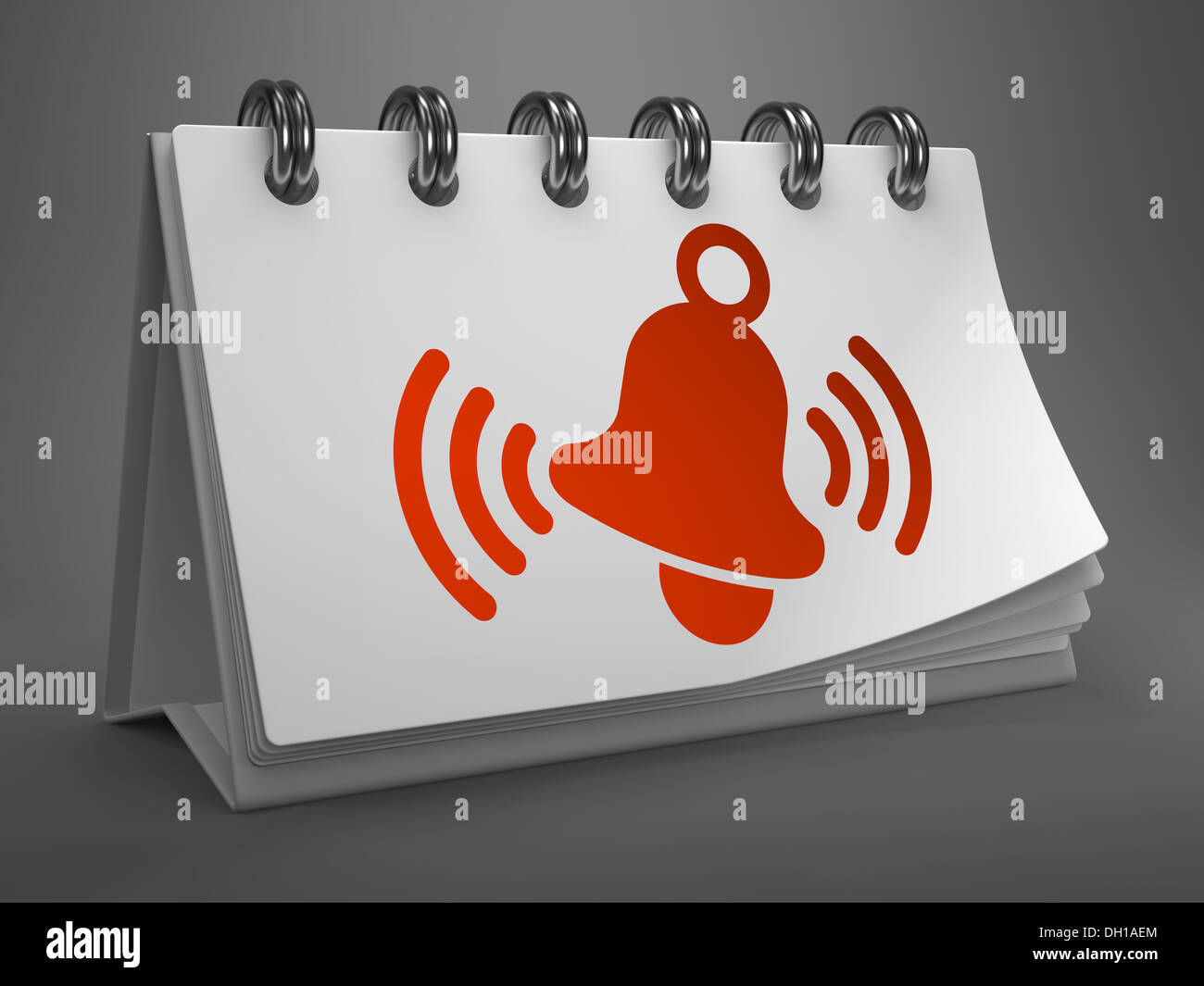 Desktop-Kalender mit rotem läuten Glocken-Symbol. Stockfoto