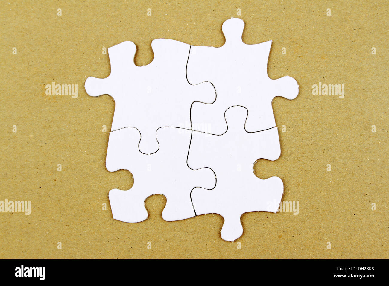 Vier Puzzlestücke zusammen Stockfoto