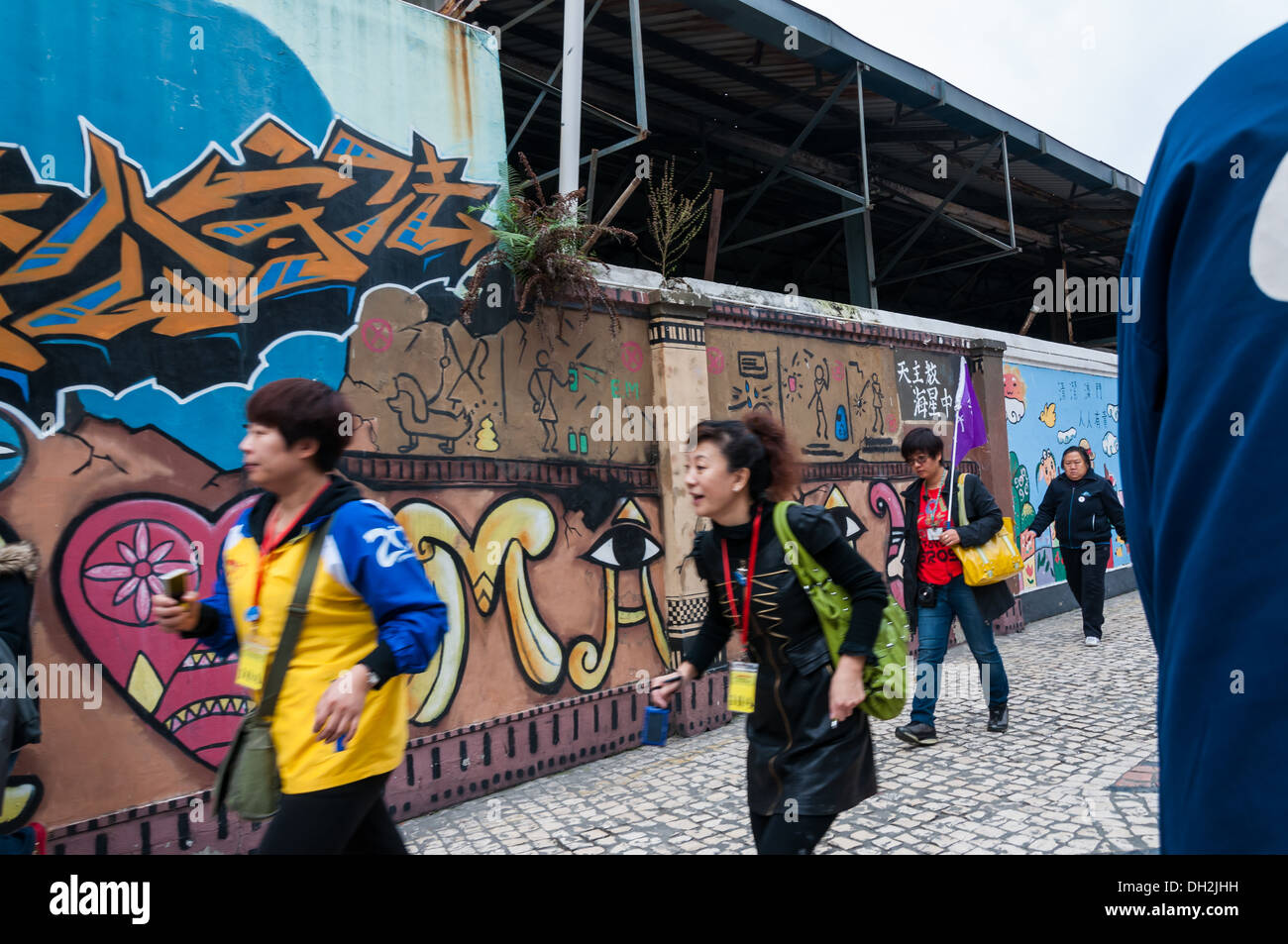 Graffiti auf der Seite eine Mauer in Macau, China. Stockfoto