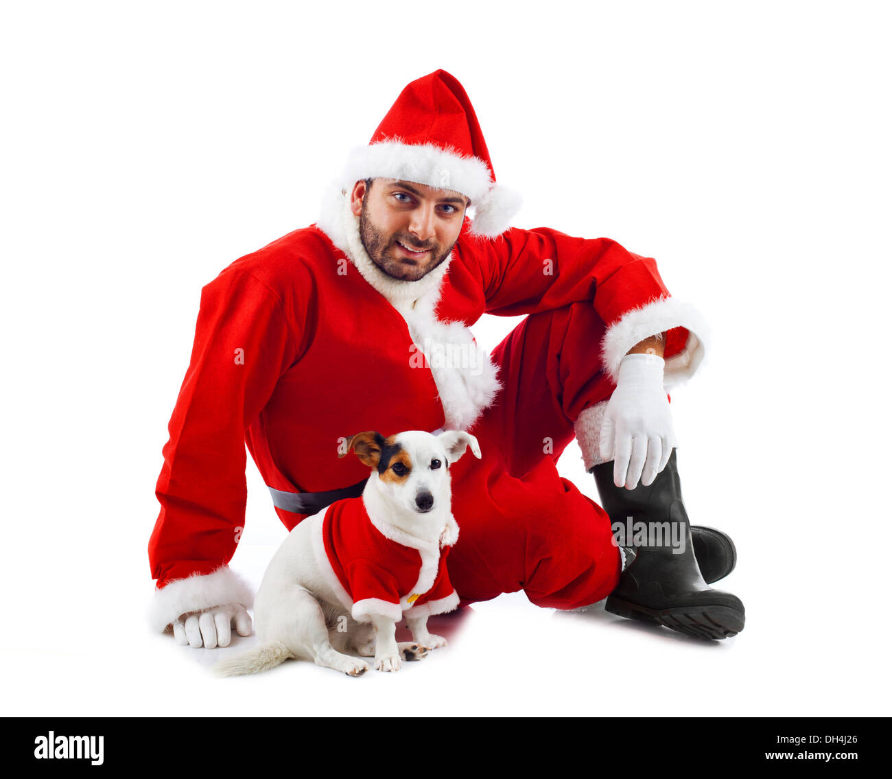 Santa Claus mit seinem kleinen Hund auf weißem Hintergrund Stockfoto