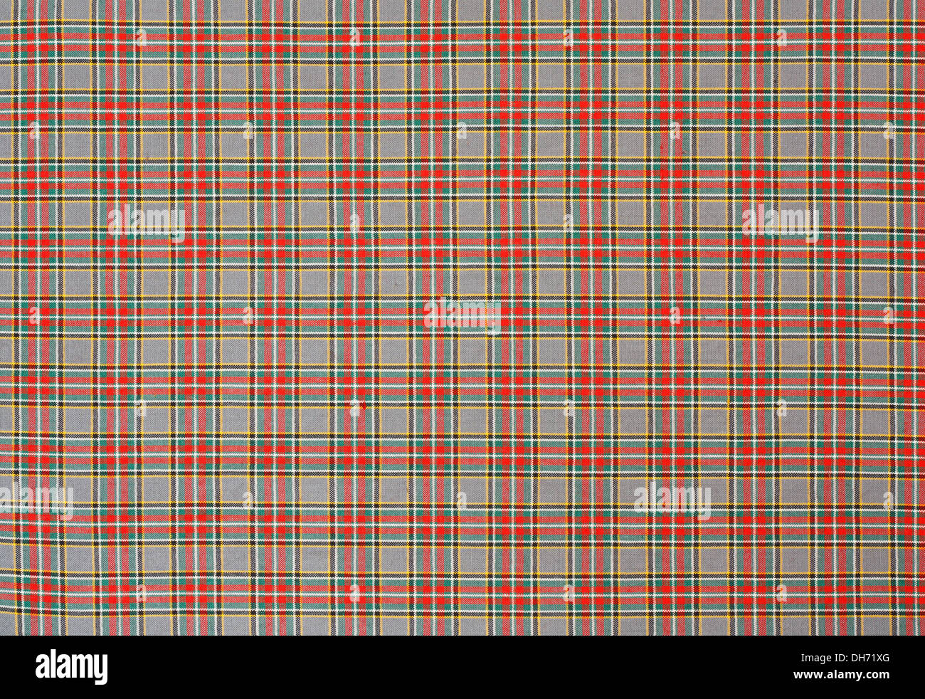 Schottischen Tartan Hintergrund ein aufgegebenes Plaid Muster mit roten, grünen und gelben Farben zu weben. Stockfoto