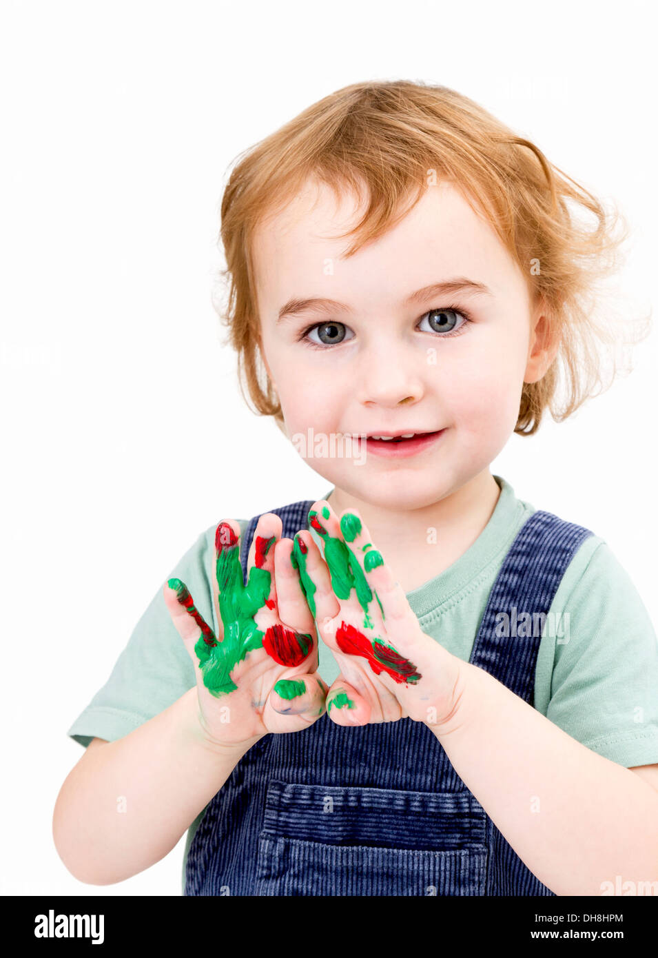 nettes Mädchen mit Fingerfarben in hellen grauen Hintergrund Stockfoto