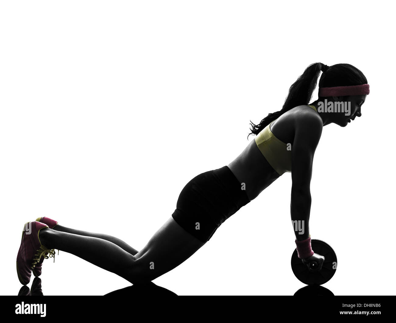 eine Frau, die Ausübung von Fitness-Training Bauch straffende Rad Silhouette auf weißem Hintergrund Stockfoto