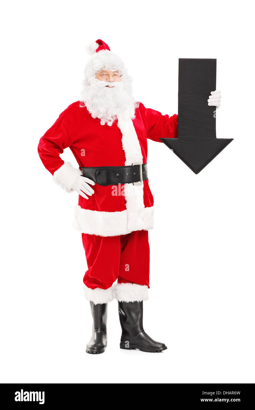 In voller Länge Portrait von lächelnden Weihnachtsmann mit einem großen schwarzen Pfeil nach unten Stockfoto