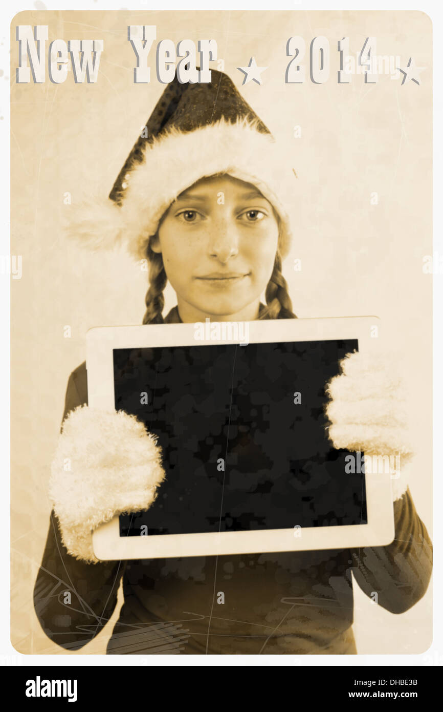 Retro-Postkarte - Mädchen in Santa Claus Hut halten TabletPC, Abbildung Stockfoto