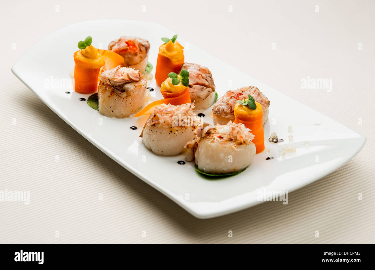 Fischfilet und Karotte mit Kürbis-sauce Stockfoto
