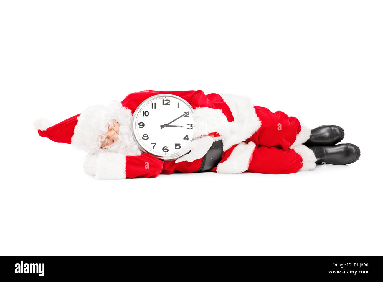 Santa Claus mit einer Uhr schlafen und spät dran Stockfoto