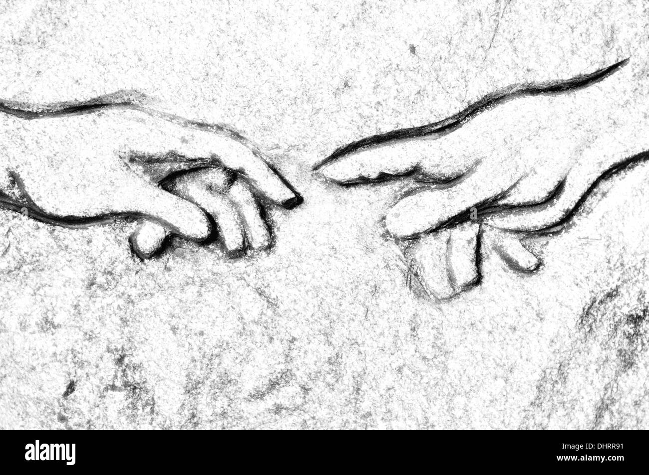 Michelangelos Erschaffung des Adam in Stein Stockfoto