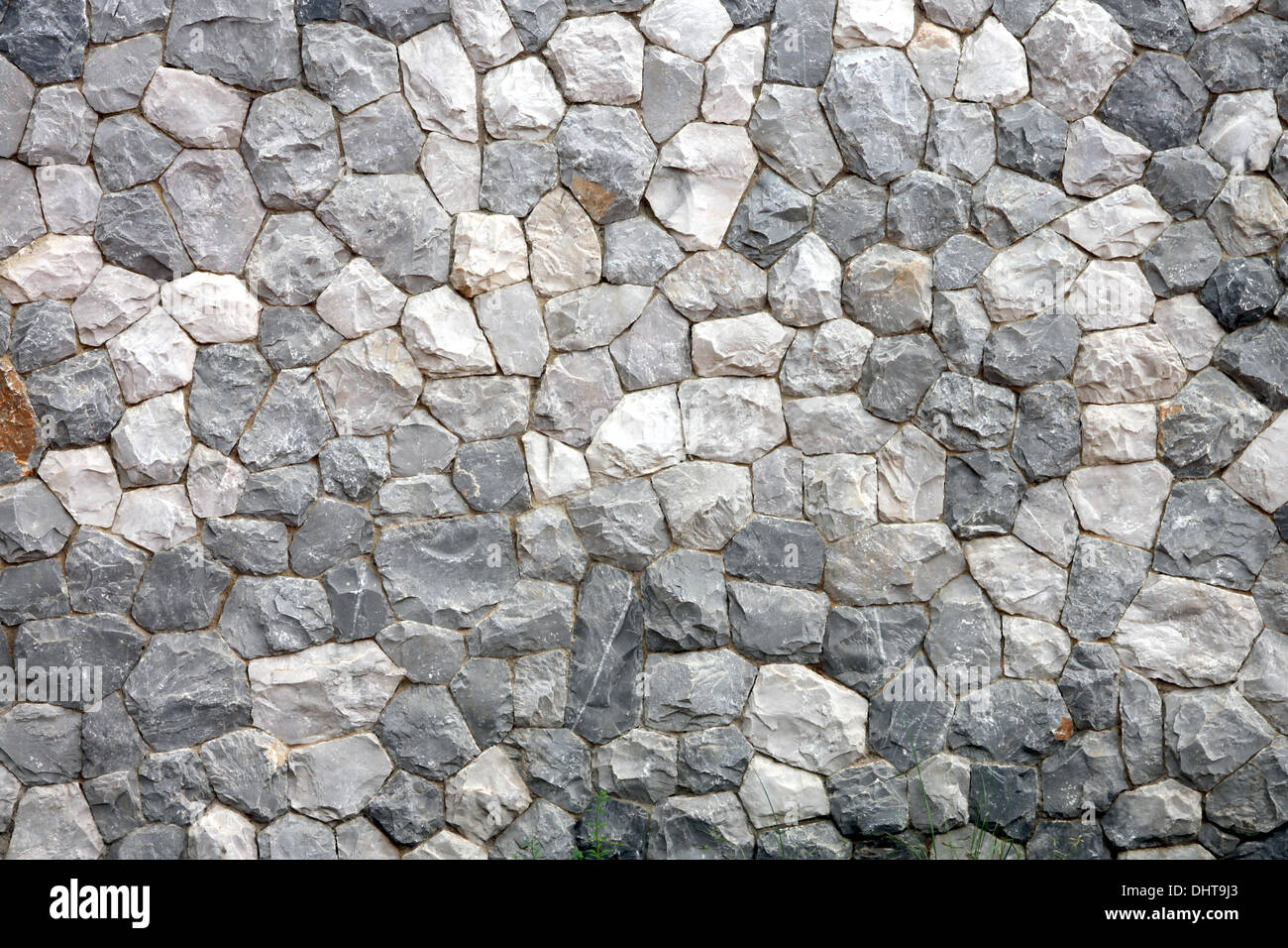 Wand von Haus aus Stein gebaut, es sieht fest und stark. Stockfoto