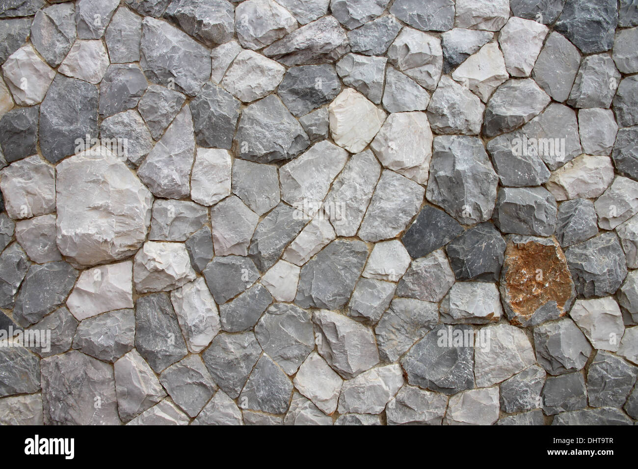 Wand von Haus aus Stein gebaut, es sieht fest und stark. Stockfoto