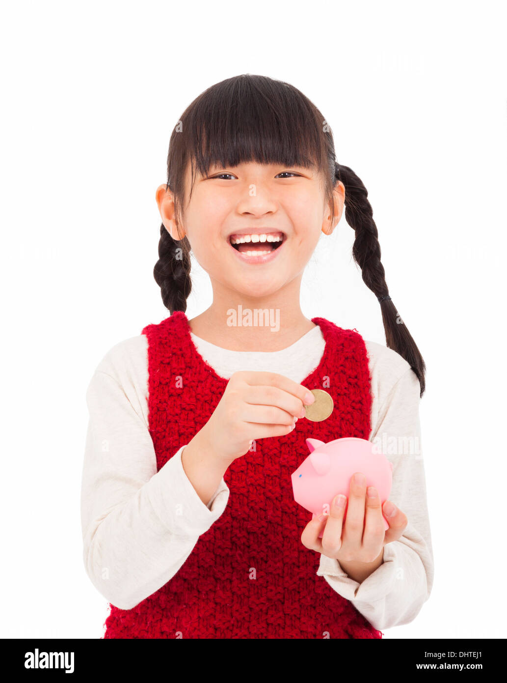 glückliches kleine Mädchen sparen Sie Geld mit Sparschwein Stockfoto