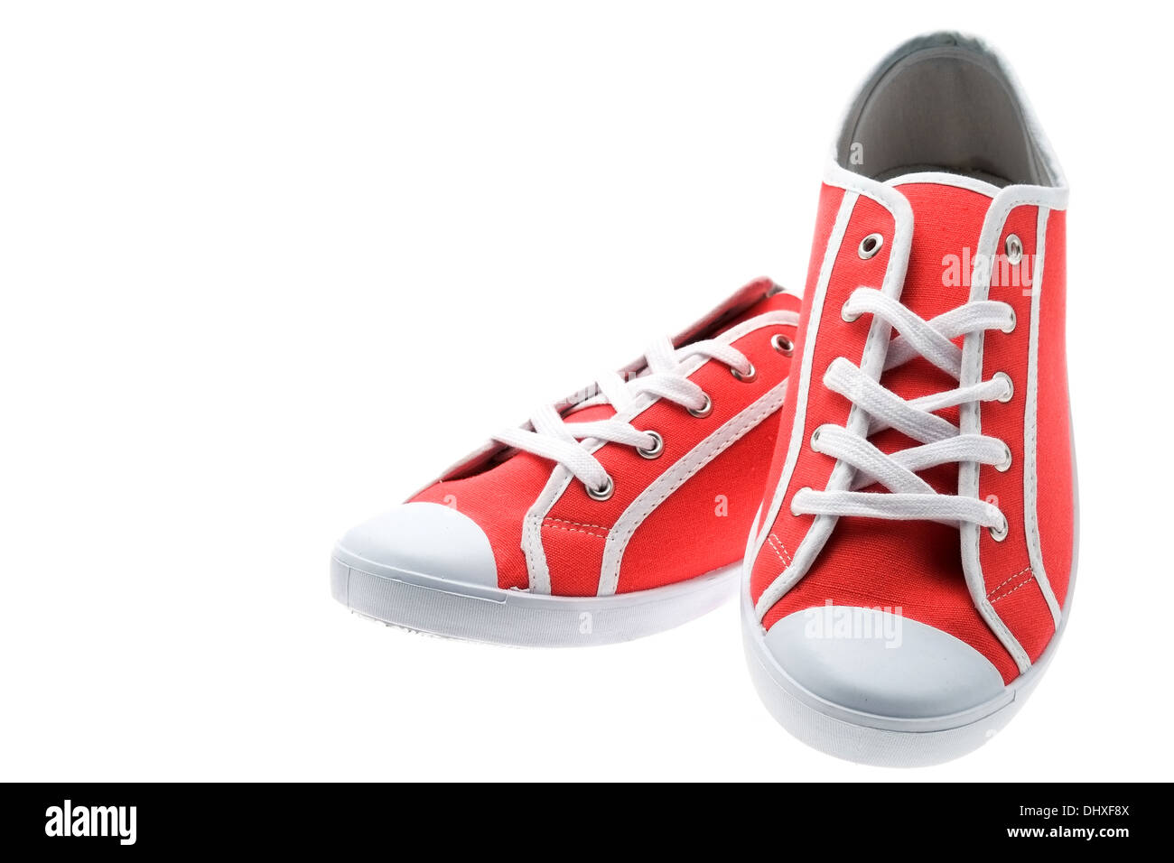Studioaufnahme von ein paar neue Red canvas-Schuhe - weißer Hintergrund Stockfoto