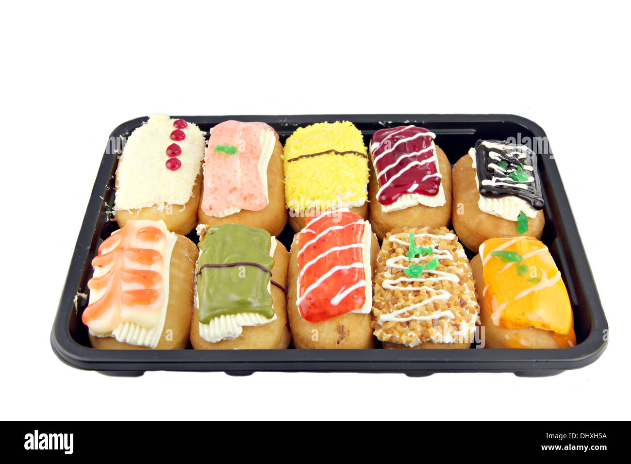 Sushi Farbe Donuts in der schwarzen Schale auf weißem Hintergrund. Stockfoto