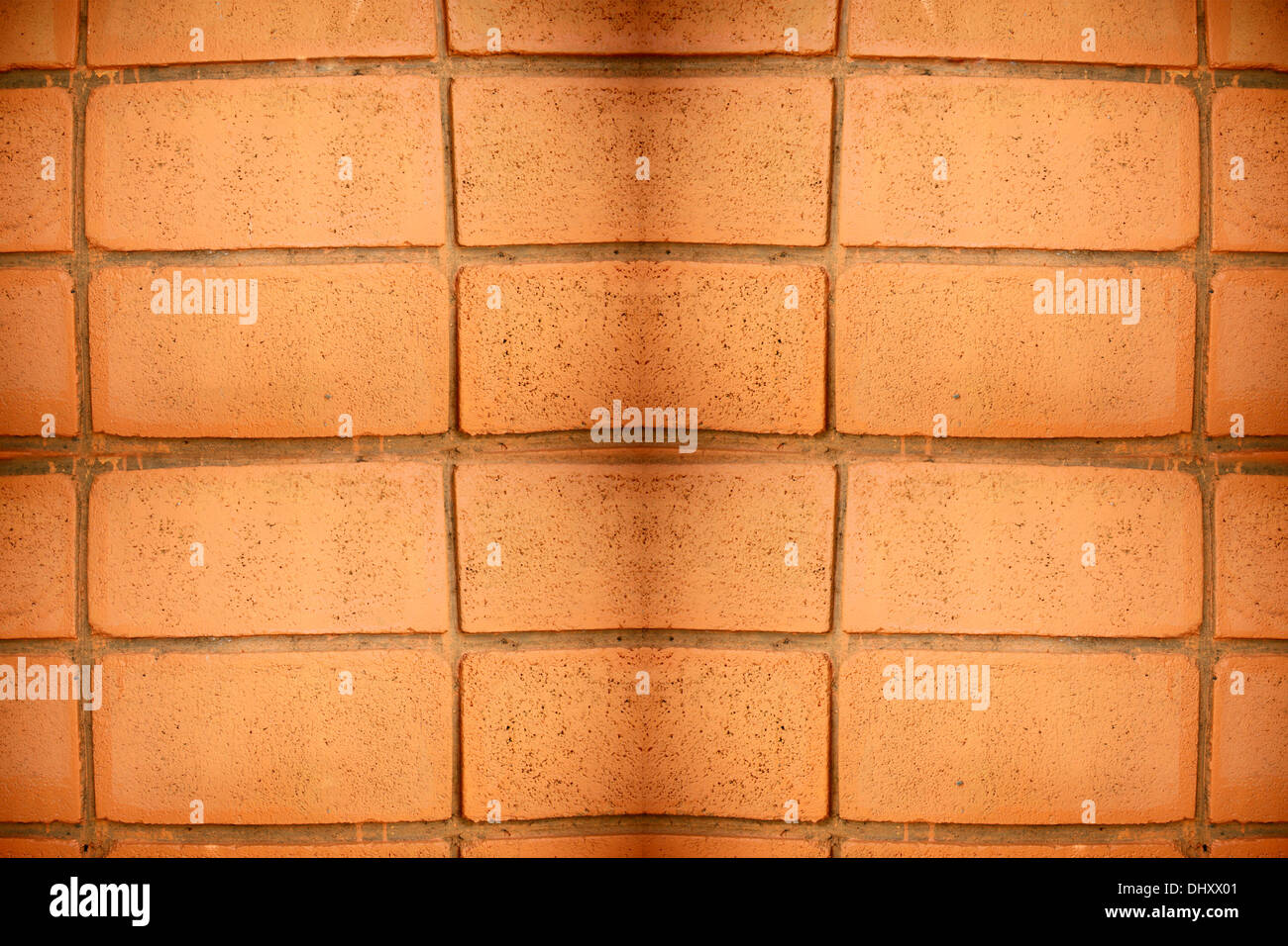 Die Bild-Ziegelwand mit Orange Hintergrund. Stockfoto