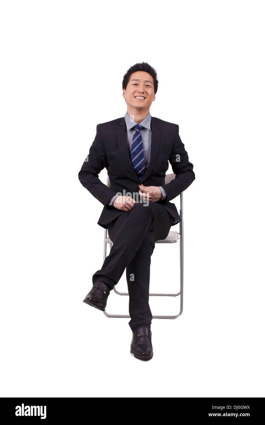 Fröhliche Geschäftsmann Sitzhaltung Stockfoto