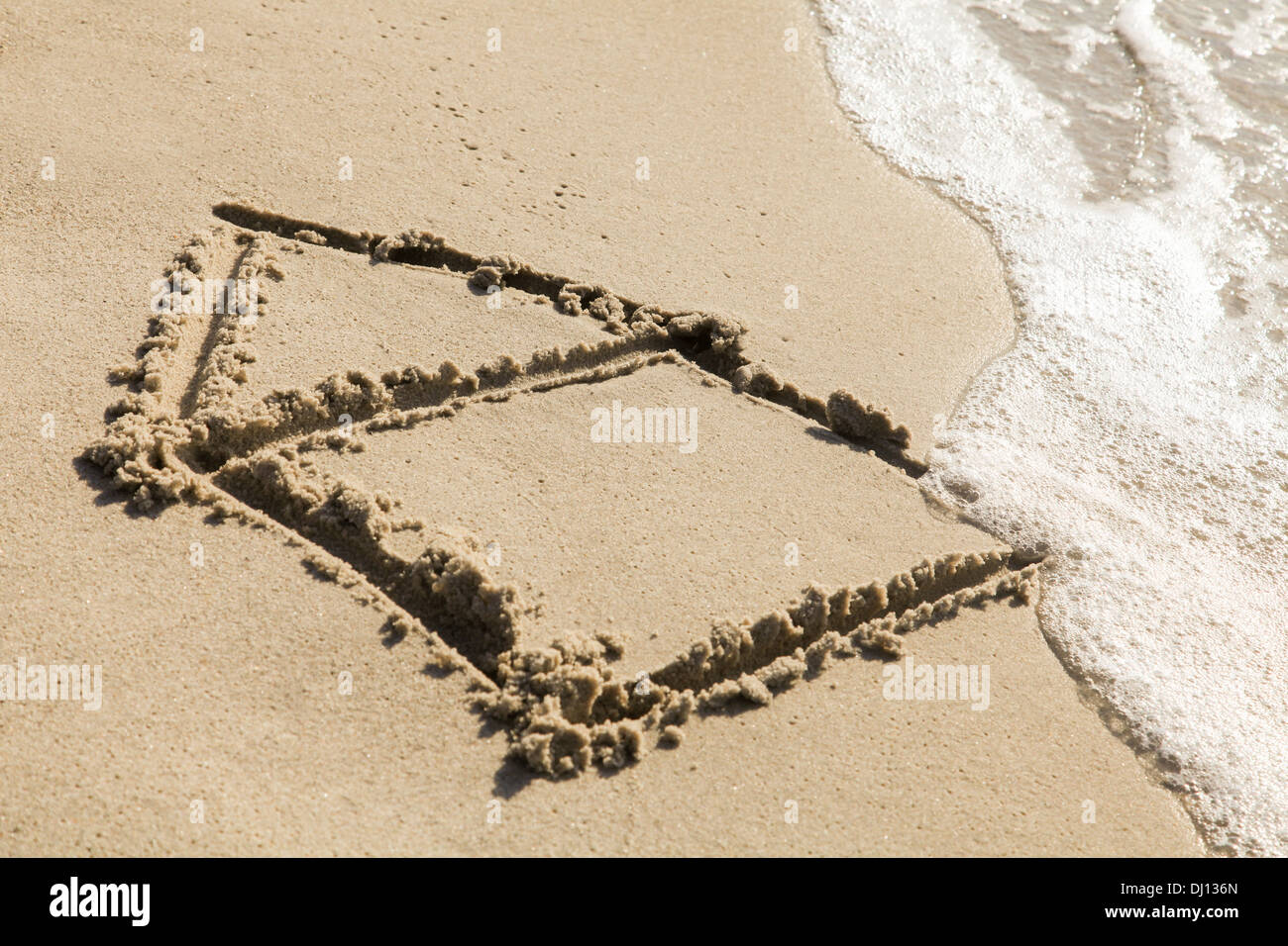 Sand am Strand zeichnen Stockfoto