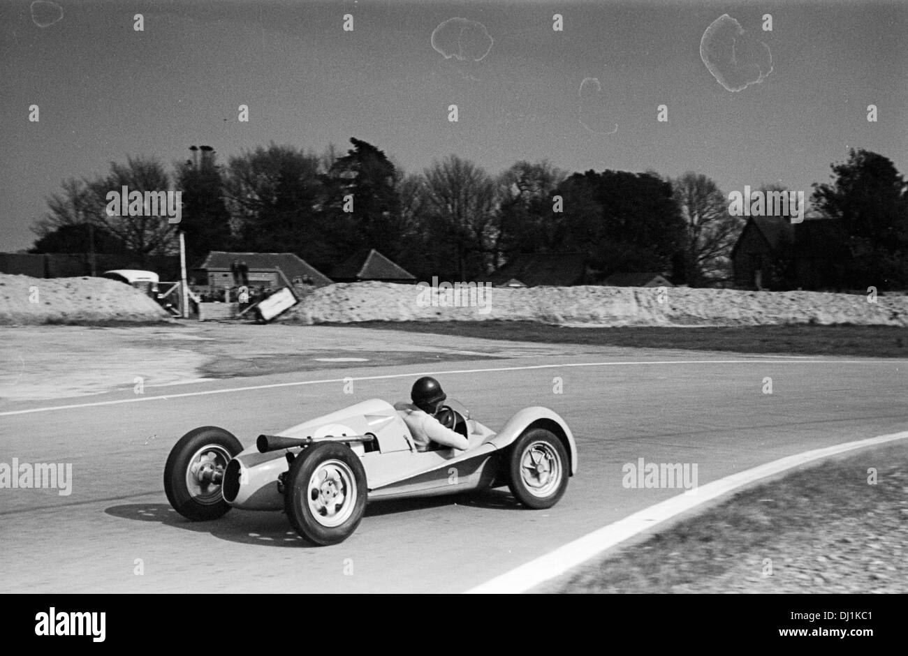 Reg Bicknell im gestrafft-gerochene Revis-Norton 500 in Goodwood, England Ostern Montag, 19. April 1954. Stockfoto