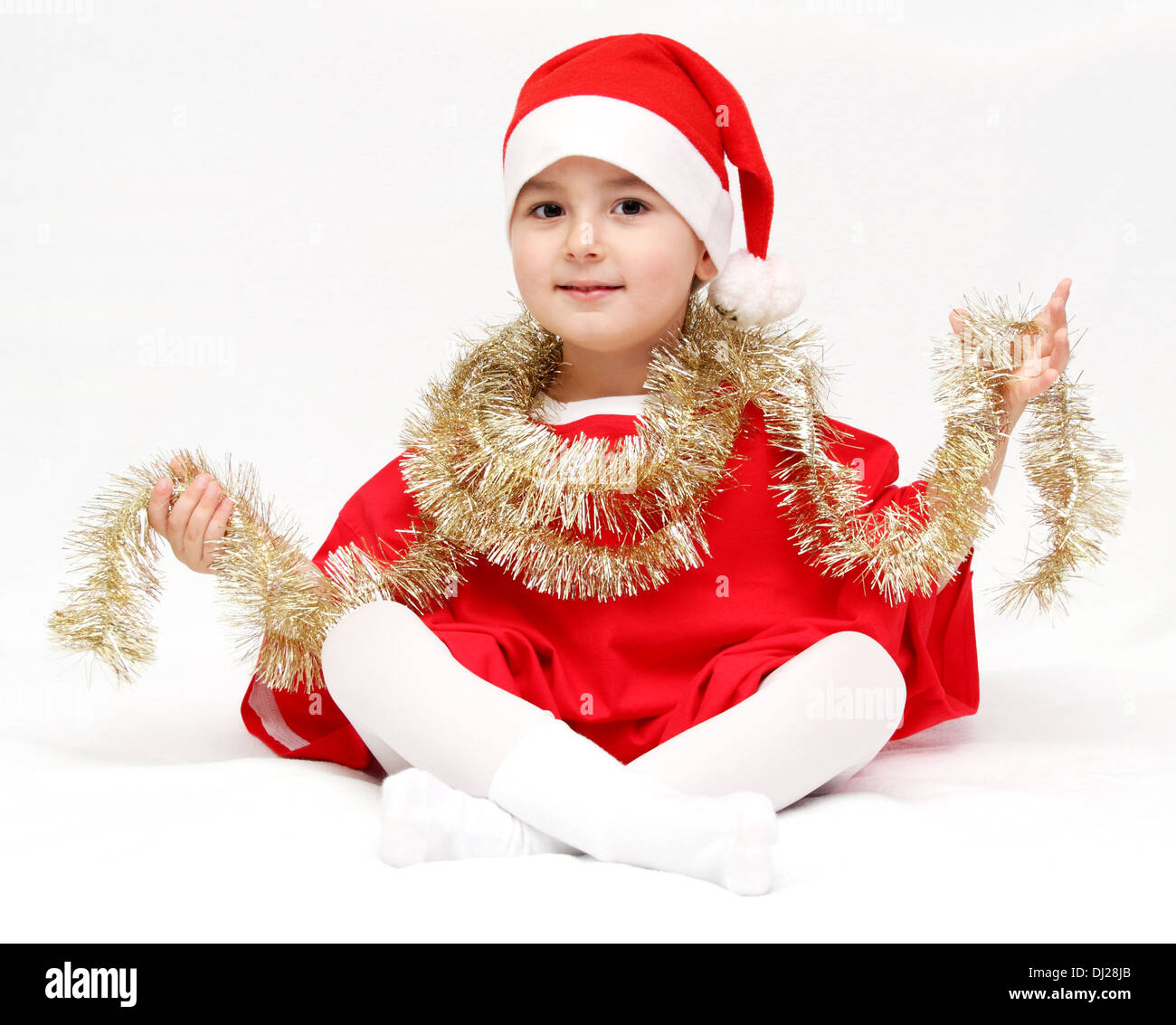 Glückliches Kind im Weihnachtsmann-Mütze Stockfoto