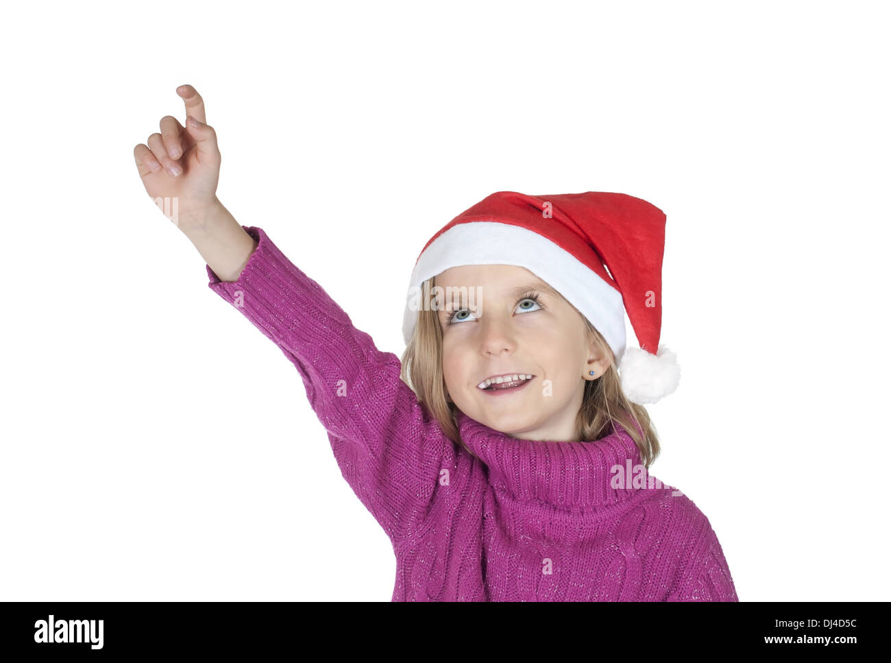 kleines Mädchen mit Weihnachtsmütze auftaucht Stockfoto