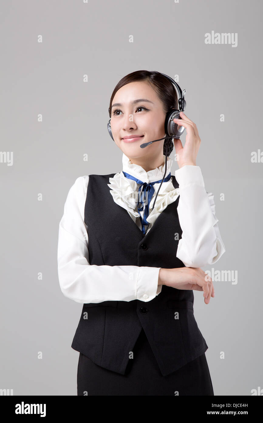 Geschäftsfrau mit Kopfhörer, Telefonistin Stockfoto