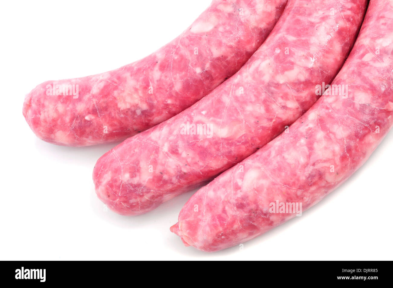 Closeup einige rohem Fleisch Schweinswürstl auf weißem Hintergrund Stockfoto