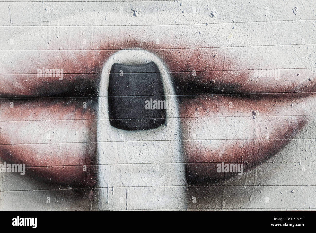 England, London, Shoreditch, Brick Lane, Wand Wandbild Darstellung Finger auf Lippen Stockfoto