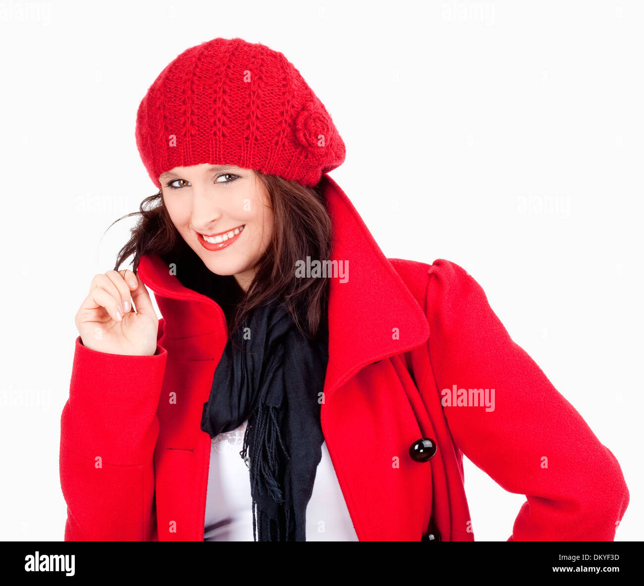 Junge Frau im roten Mantel und Kappe lächelnd - Isolated on White Stockfoto