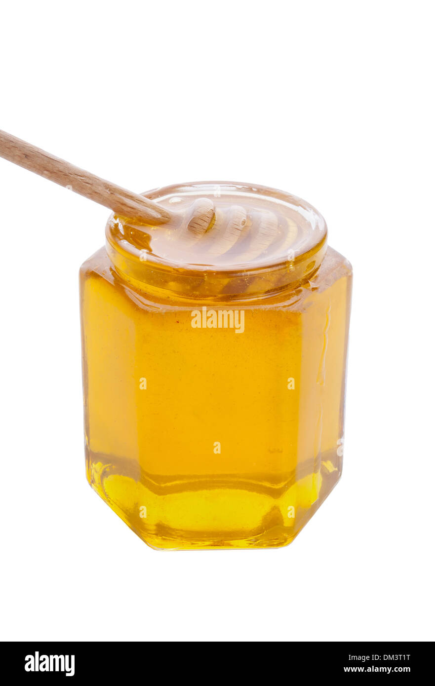 Glasglas Honig mit hölzernen Drizzler isoliert auf weißem Hintergrund Stockfoto
