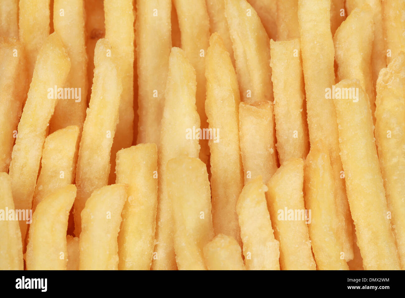 Pommes frites bildet einen Fast-Food-Hintergrund Stockfoto