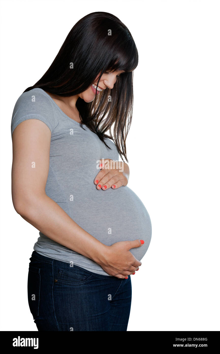 Glücklich schwanger Frau mit Händen auf Magen Stockfoto
