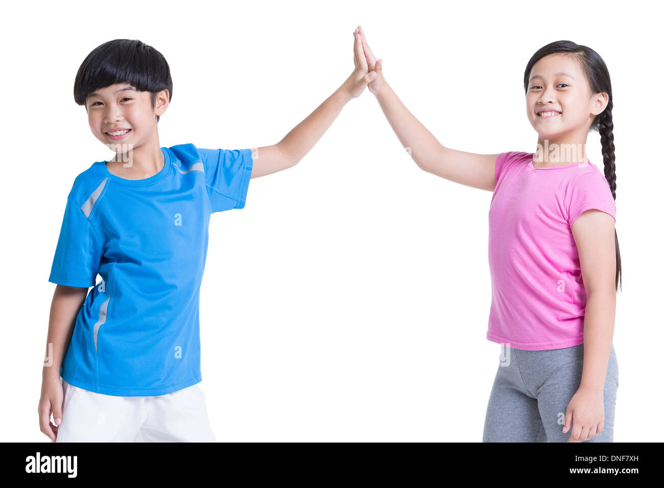 Glückliche Kinder geben High-Five Stockfoto