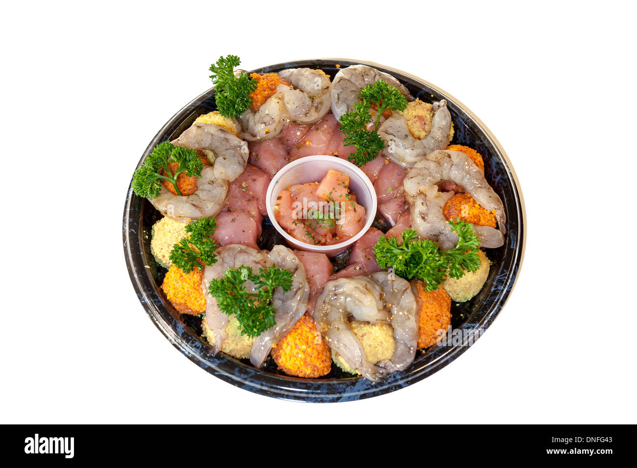 Fondue ist ein Gericht in welchen Nahrungsmitteln in kleine Stücke in eine warme oder heiße Flüssigkeit eingetaucht sind. Das Wort Fondue bedeutet geschmolzen in französischer Sprache Stockfoto