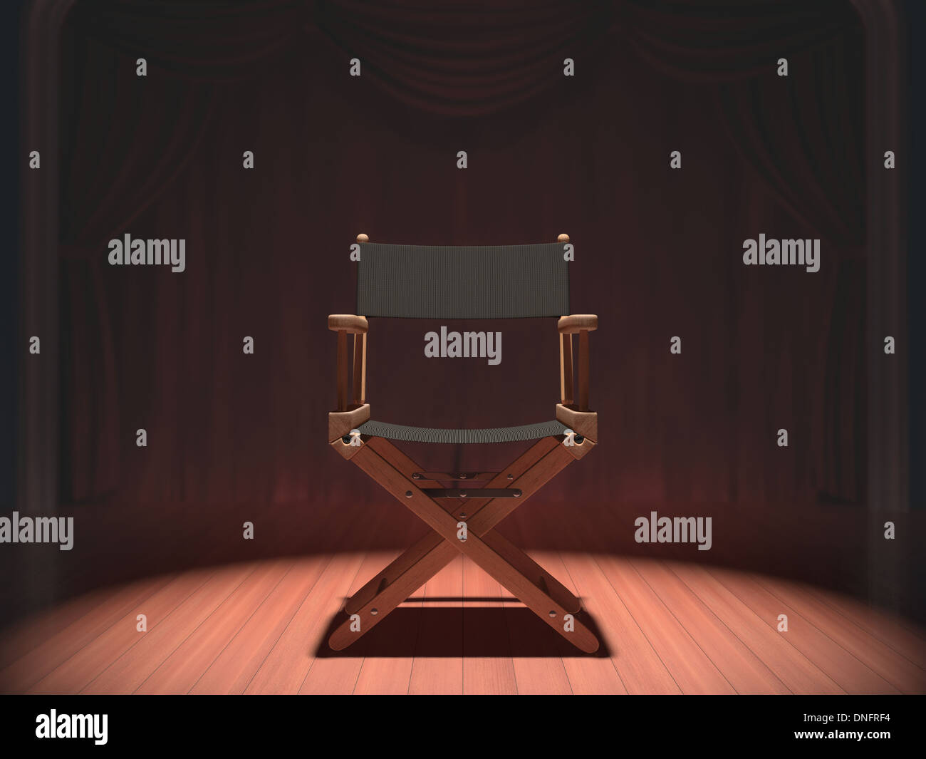 Der Stuhl des Regisseurs auf der Bühne durch Flutlicht beleuchtet. Stockfoto