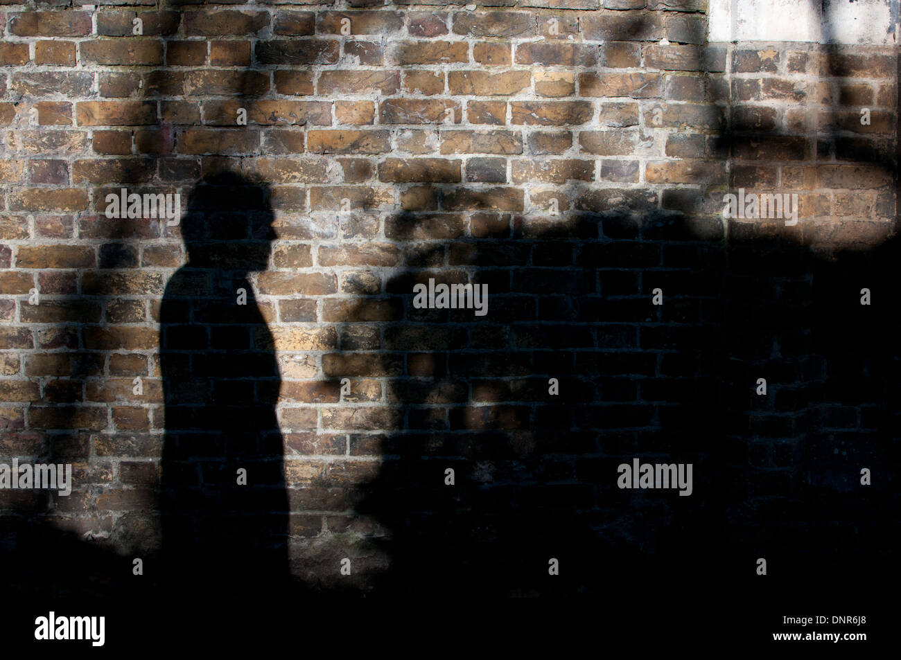 Schatten eines Mannes (des Fotografen Ehemann) Stockfoto