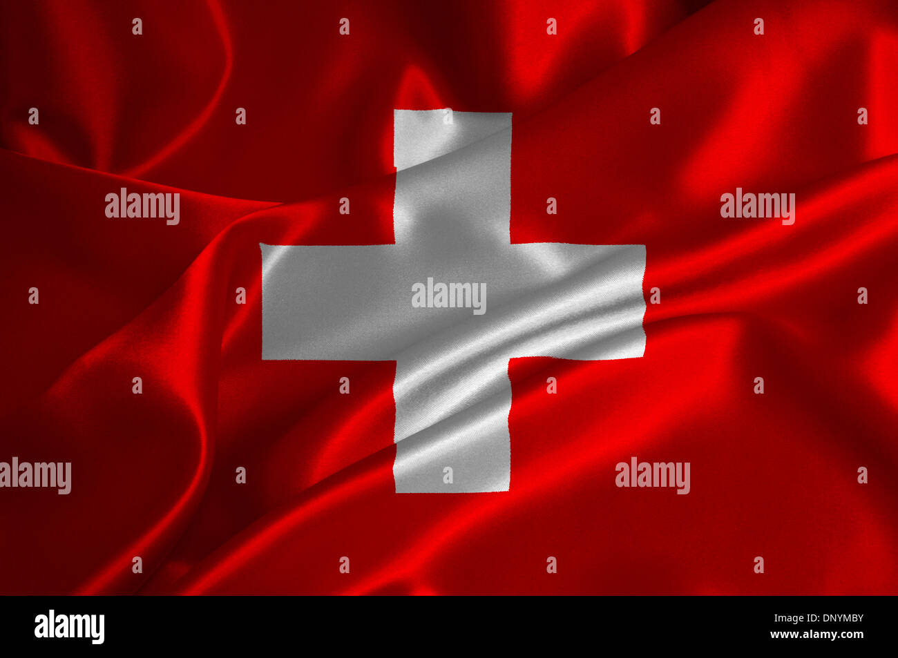 Schweiz Flagge auf seidige Textur. Stockfoto