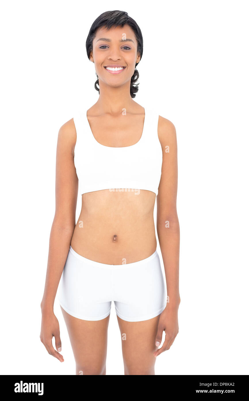 Lächelnde Fit Frau posiert, Blick in die Kamera Stockfoto