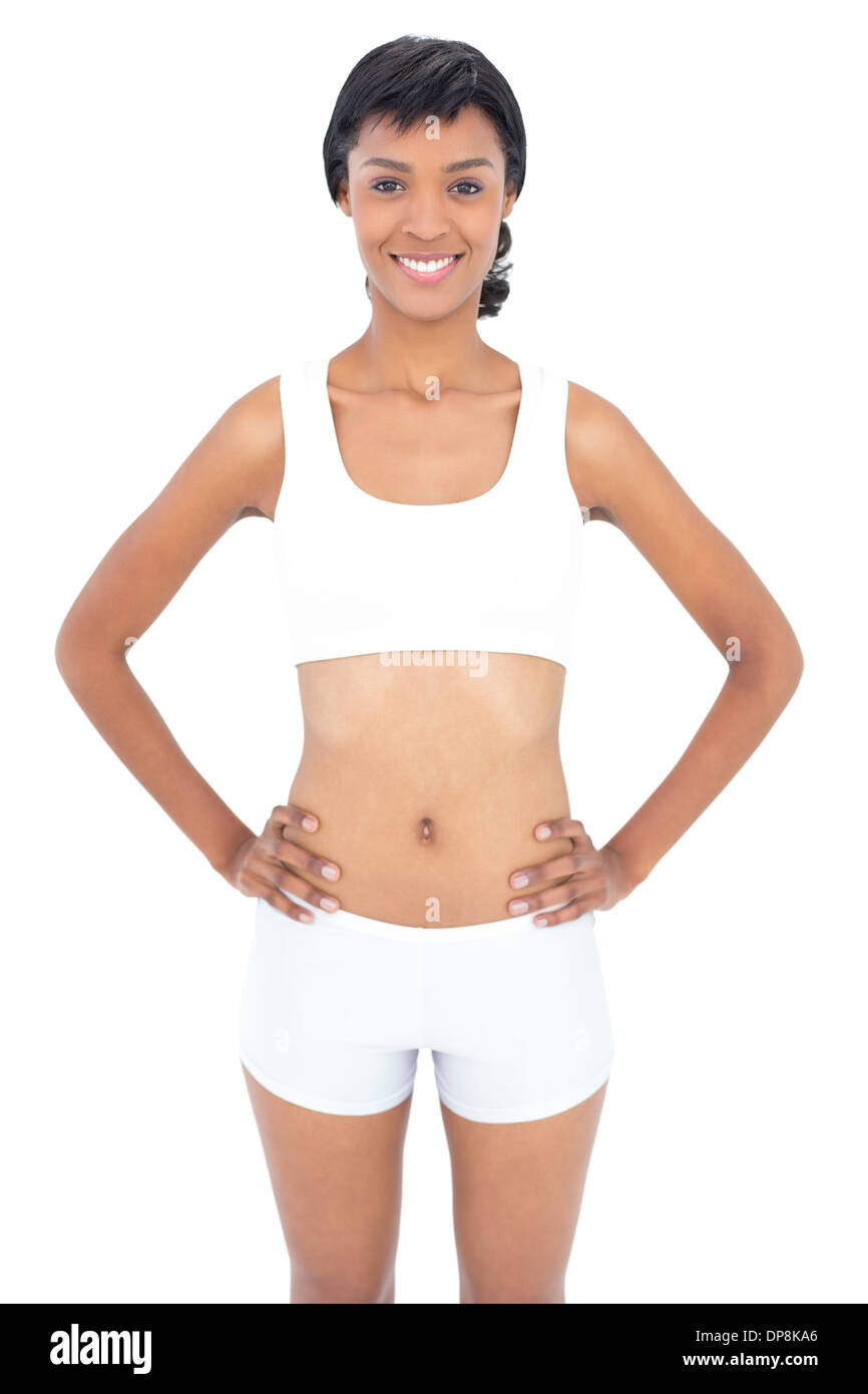 Attraktive passen Frau posiert Hände an den Hüften Stockfoto
