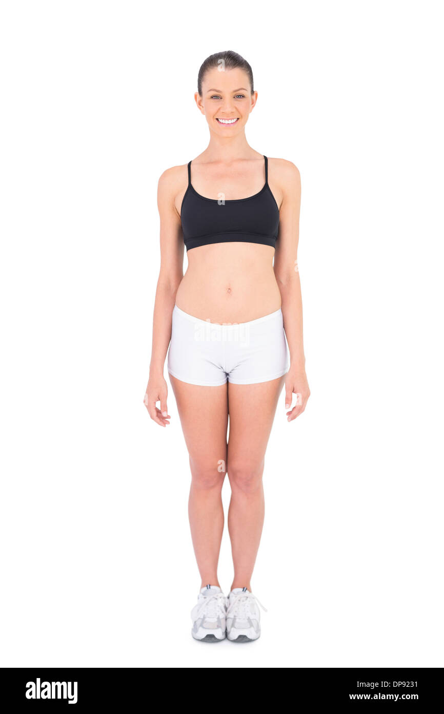 Fit Trägerin Sportbekleidung lächelnd in die Kamera Stockfoto