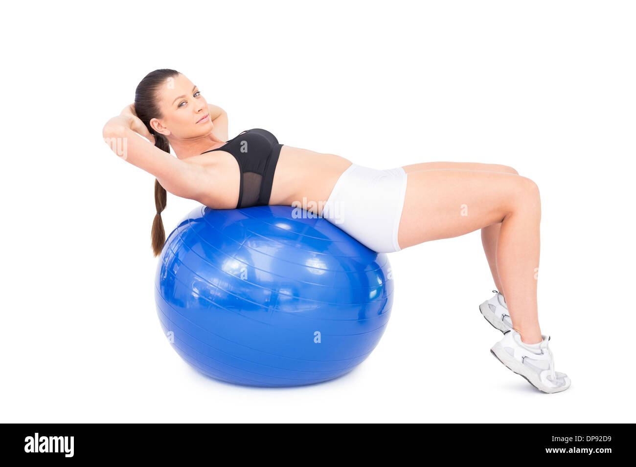 Umwerfende Fit Frau Workout mit Gymnastikball Stockfoto