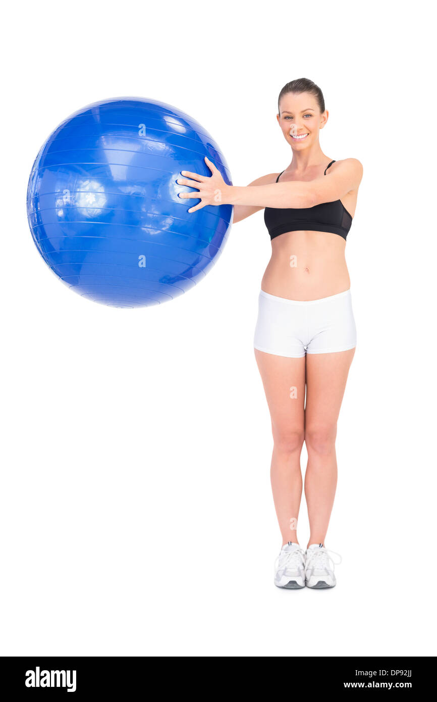 Happy fit Frau Training mit Gymnastikball Stockfoto