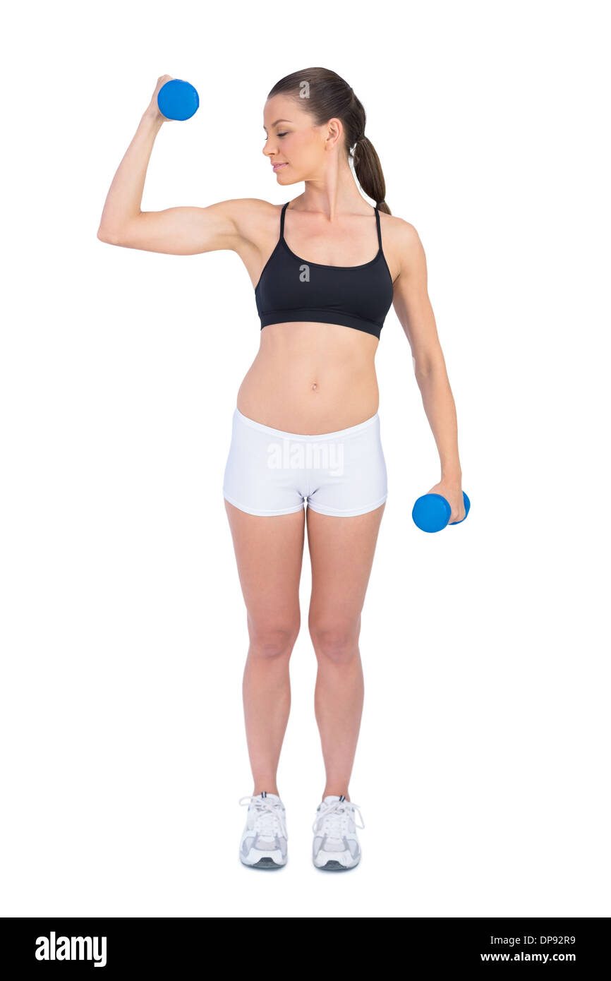 Entspannt Fit Frau Training mit Hanteln Stockfoto