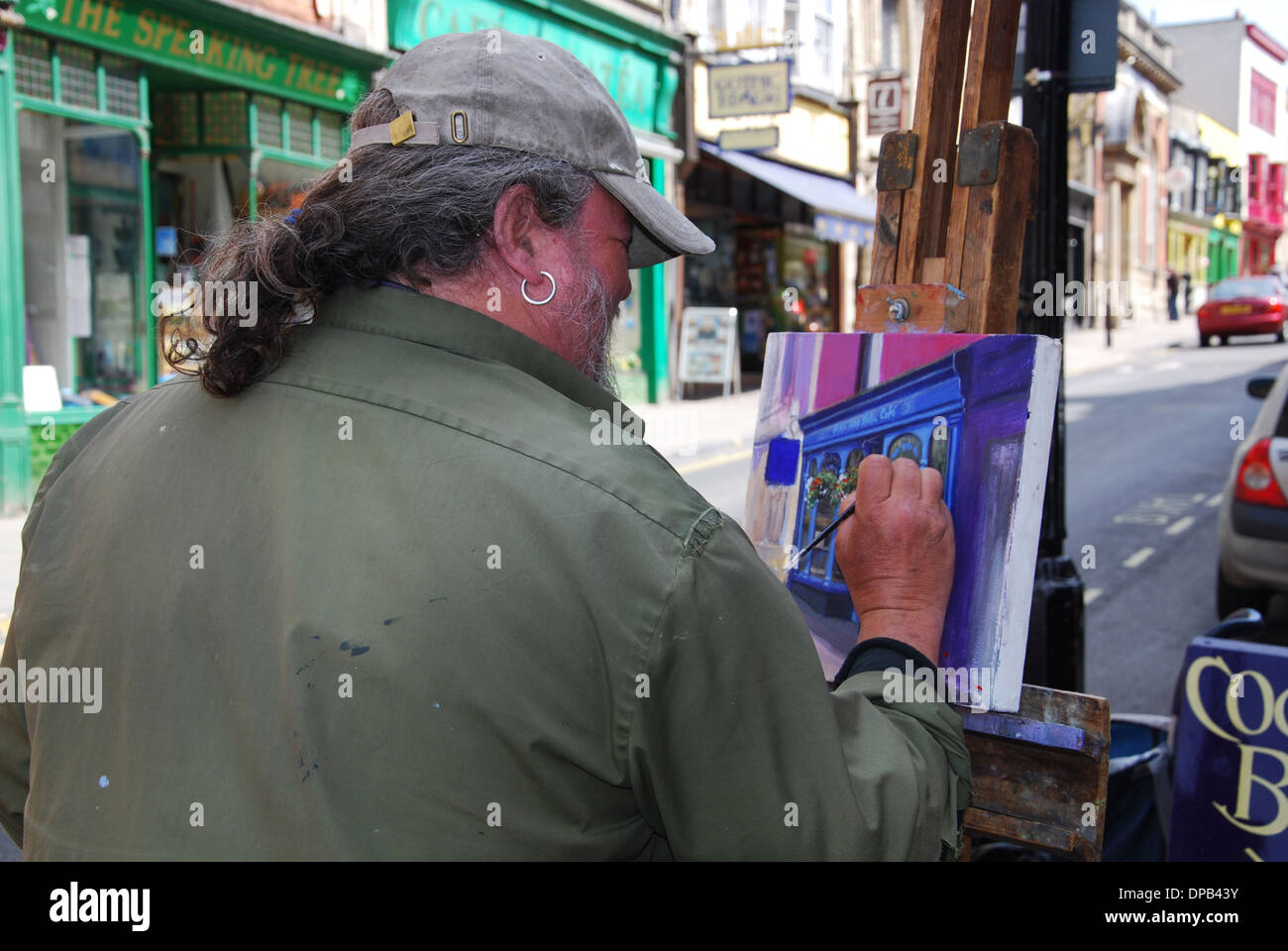 Künstler in Glastonbury High Street, Somerset UK Stockfoto