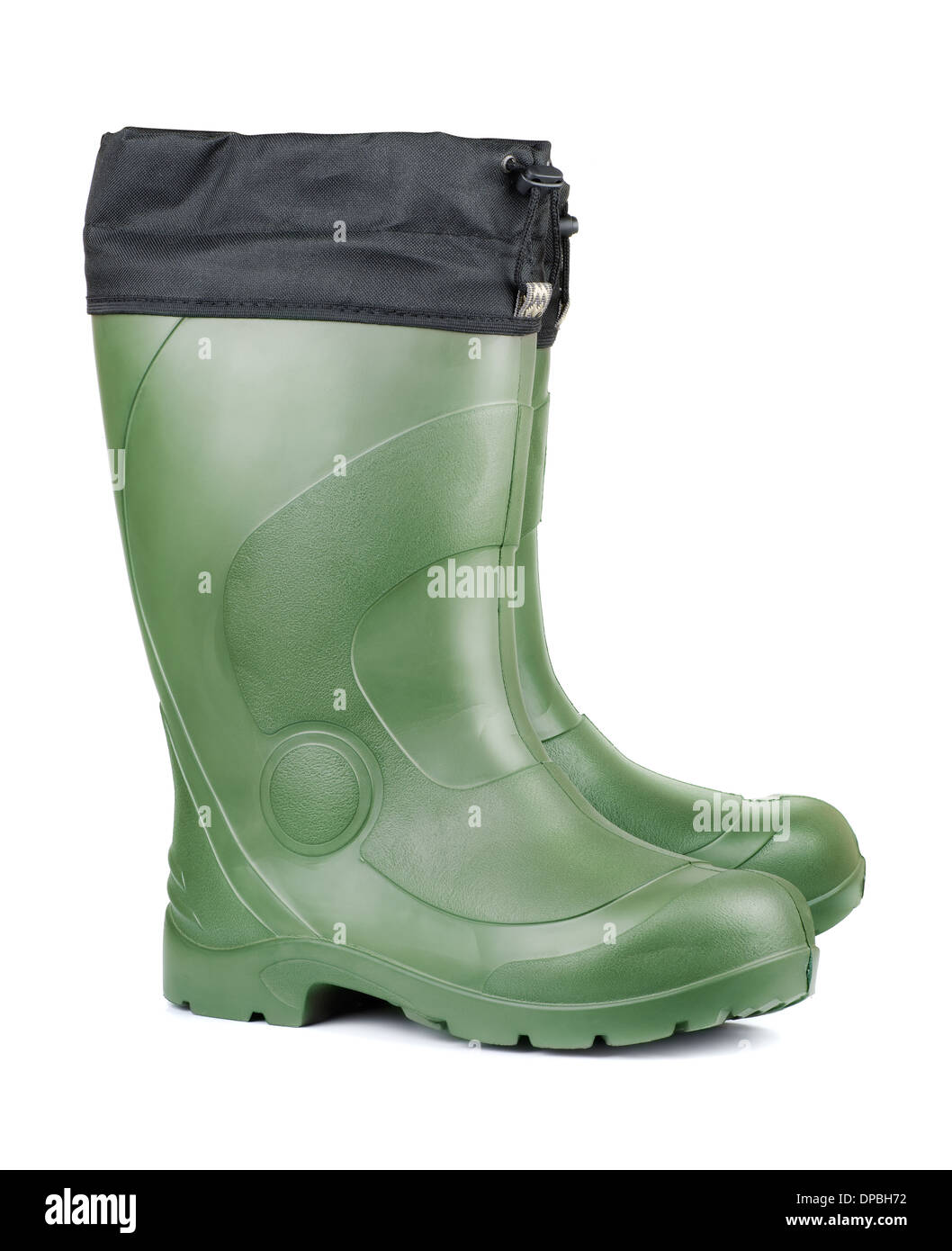 Paar grüne Gummistiefel isoliert auf weiss Stockfoto