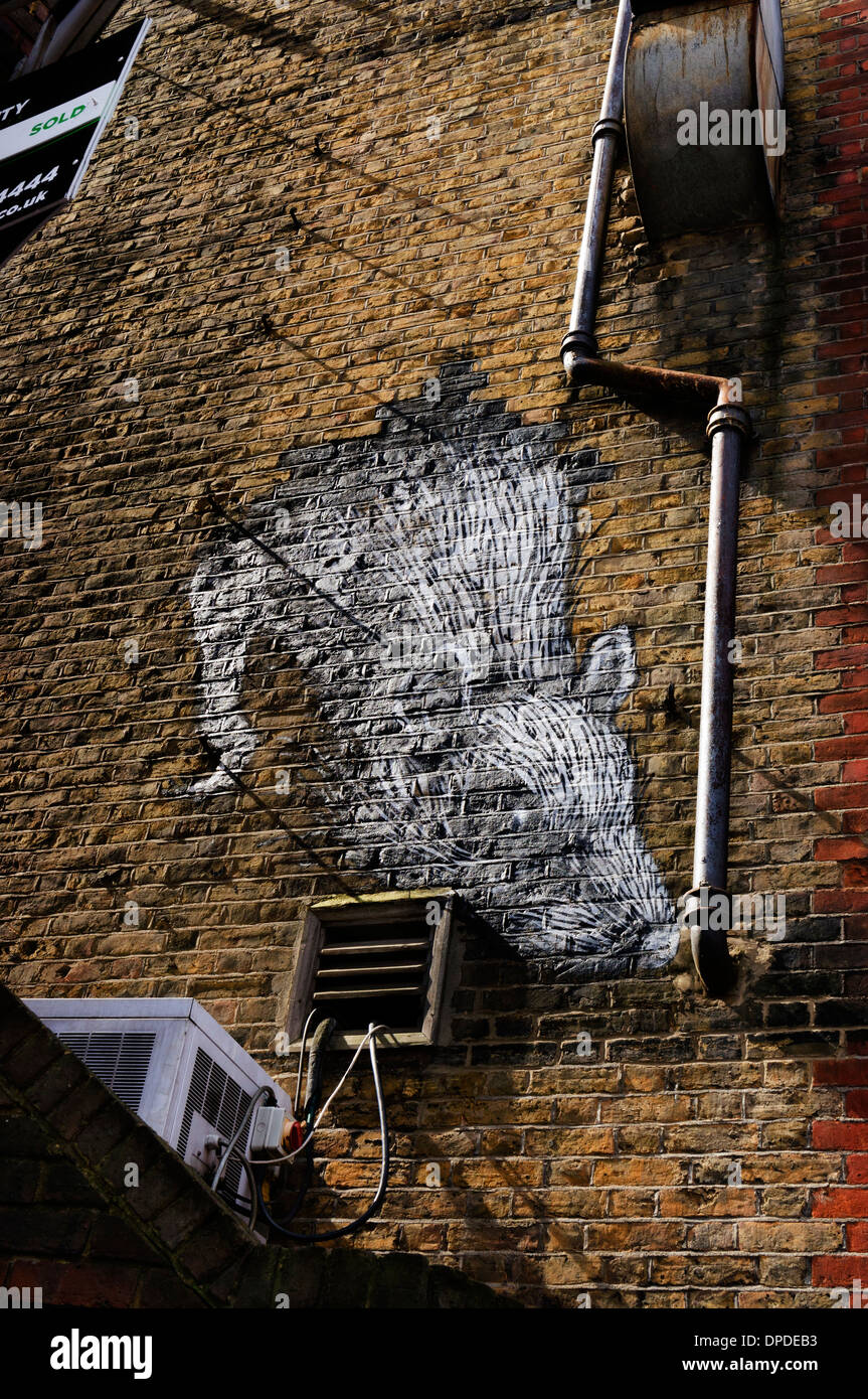 Urban Street Spray kann Wand gemalte Kunstwerke eine riesige Ratte, Brick Lane Bereich, East London E1 UK Stockfoto