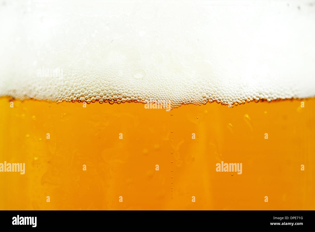 Bier und Bier Schaum Kulisse. Glas Bier Closeup. Stockfoto