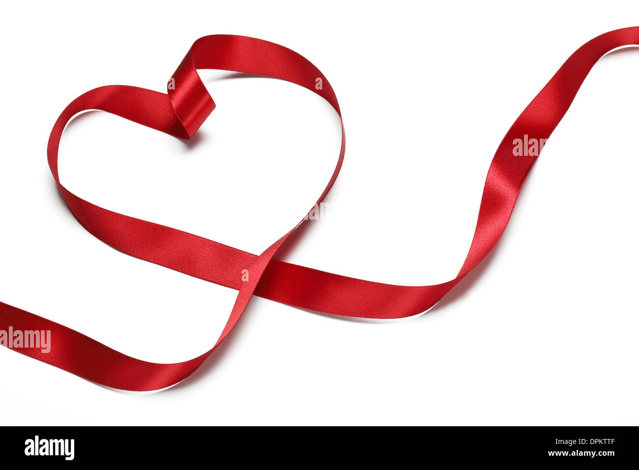 Red Ribbon in Herzform, Valentines Konzept. Stockfoto