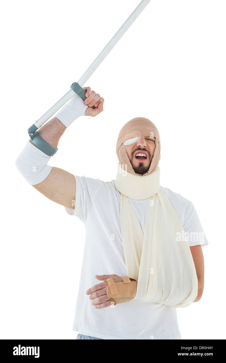 Fröhlicher Mensch mit gebrochenen Hand und Krücke jubeln Stockfoto Fröhlicher Mensch mit gebrochenen Hand und Krücke jubeln Stockfoto