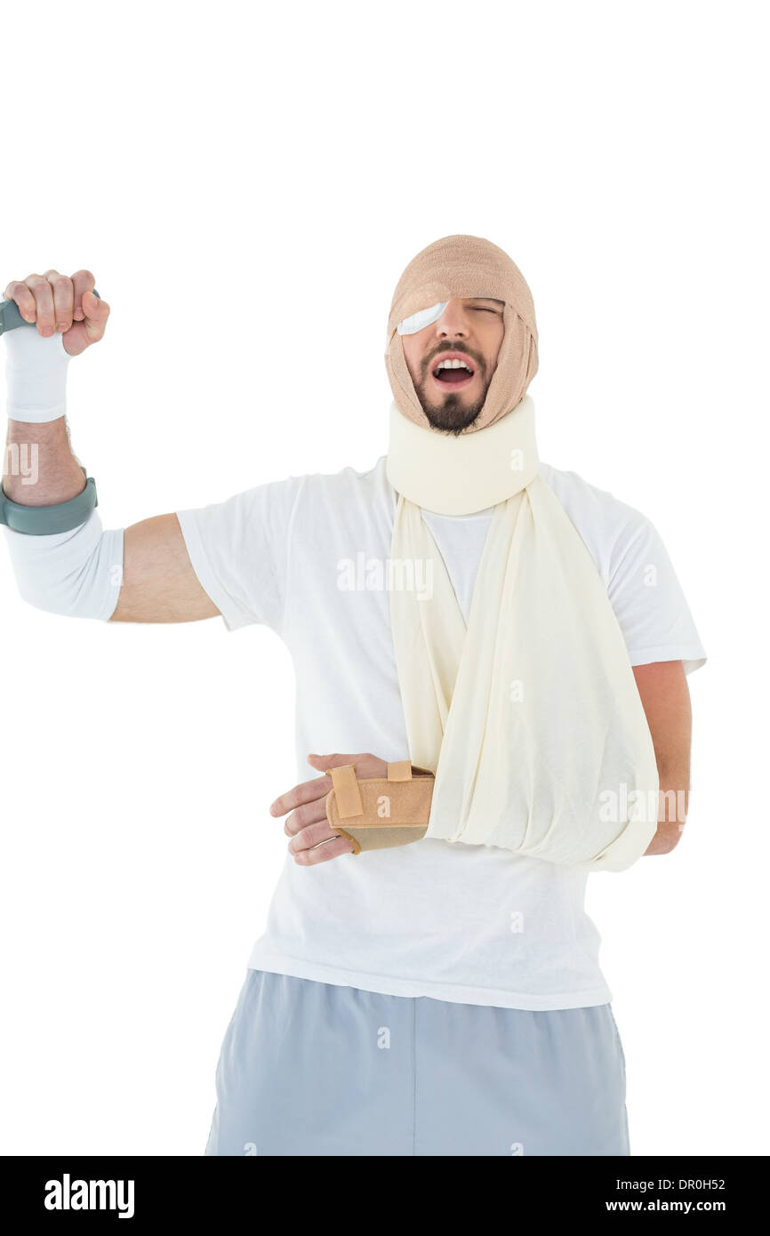 Fröhlicher junger Mann mit der gebrochenen Hand jubeln Stockfoto Fröhlicher junger Mann mit der gebrochenen Hand jubeln Stockfoto