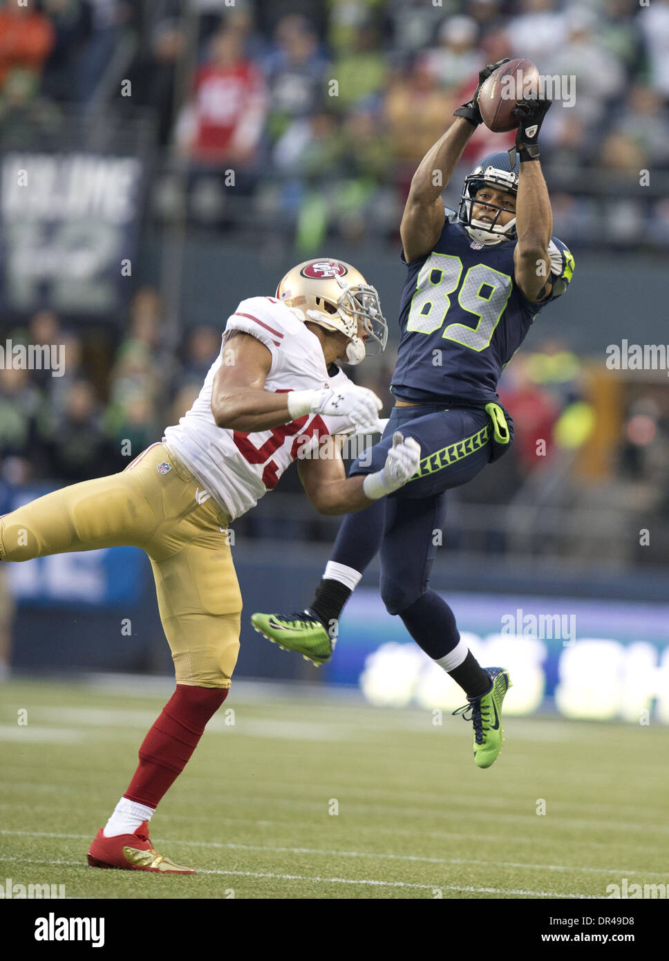 Seattle, Washington, USA. 19. Januar 2014. Seattle Seahawks Wide Receiver DOUG BALDWIN (89) macht einen Haken für ein First Down während der NFC Championship Spiel gegen die San Francisco 49ers bei CenturyLink Field. Bildnachweis: Hector Amezcua/Sacramento Bee/ZUMAPRESS.com/Alamy Live-Nachrichten Stockfoto