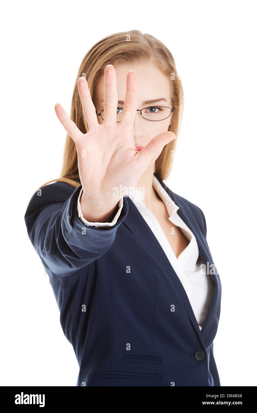 Schöne Geschäftsfrau zeigt Stop Geste mit der hand. Isoliert auf weiss. Stockfoto